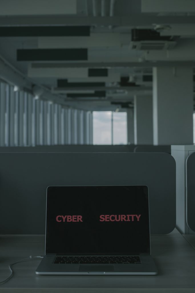 Microsoft 365 Laptop displaying 'Cyber Security' in a modern office setting, emphasizing tech and cybersecurity themes.